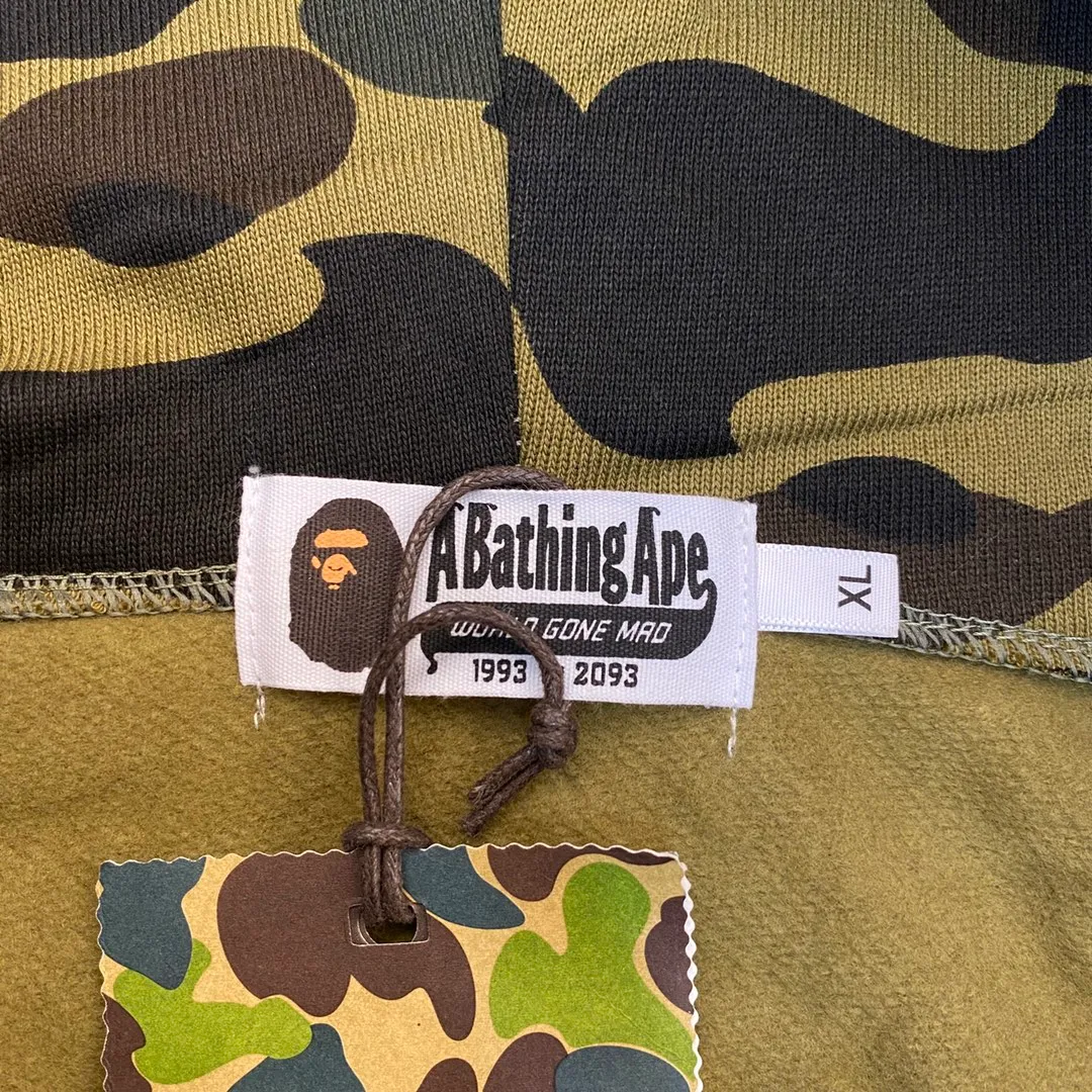XX 121 BAPE 1ST CAMO SHARK FULL Classic counter model Camouflage shark hooded zipper sweatshirt Machine-printed camouflage Top-quality fabric Premium 1:1 replica Customized fabric Couple model: S—XXL [Camouflage yellow, Camouflage green, Camouflage red, Camouflage purple, Camouflage blue, Camouflage gray]